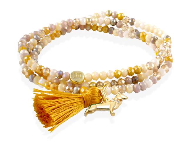 Pulsera ZEN PIEDRA con perro de Marina Garcia Joyas en plata Pulsera de plata de primera ley (925) chapada en oro amarillo de 18kt, con nucleo de silicona elástica y cristal de strass facetado, con charm perro. Talla media de 17 cm. (51 cm. total)