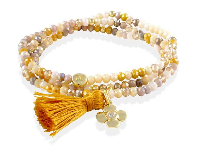 Pulsera ZEN PIEDRA con flor de Marina Garcia Joyas en plata Pulsera de plata de primera ley (925) chapada en oro amarillo de 18kt, con nucleo de silicona elástica y cristal de strass facetado, con charm flor. Talla media de 17 cm. (51 cm. total)